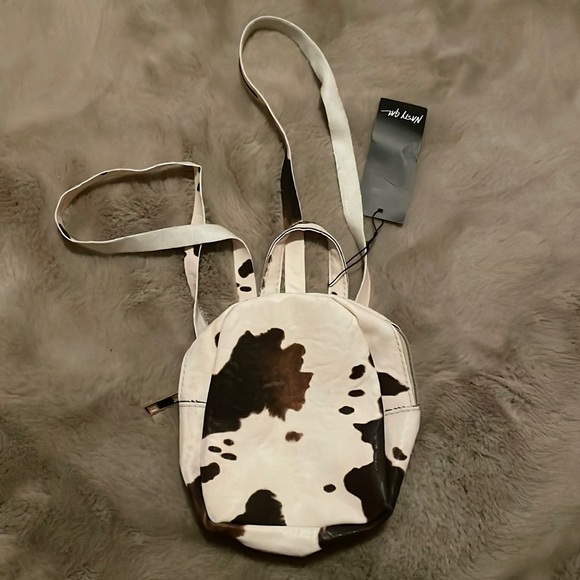 MOVING SALE!! NWT Cow print mini backpack! - Picture 1 of 3
